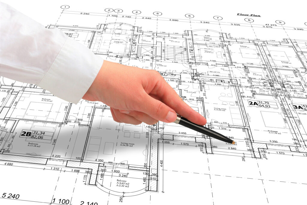 This image shows the man rendering the perfect house plan blueprint.